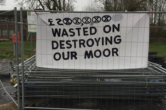 Rebels from Extinction Rebellion Dacroum removed the fencing and displayed a banner at Moor car park