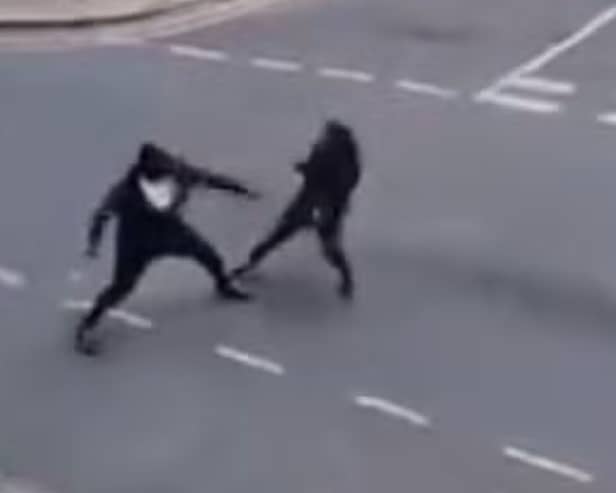 Two men seen fighting with Rambo knives on Cadoxton Avenue in Tottenham
