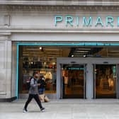 A pedestrian walks past a Primark store on Oxford Street.