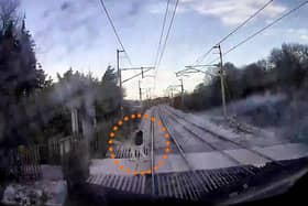 The video shows a man just inches from being hit by the speeding train.