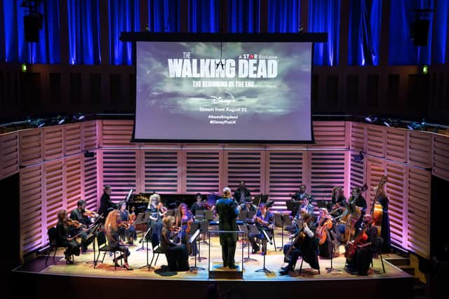 The Covent Garden Sinfonia orchestra, made over as the living dead, perform a symphonic rendition of TheWalking Dead’s theme tune to a live audience at King’s Place Concert Hall in London, during the Star on Disney+ premiere of the first episode of the 11th and final season of the TV show, ahead of it airing on the platform from August23.
