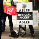 LONDON, ENGLAND - MAY 31: A group of rail workers stand on a picket line outside Euston rail station as a new round of strikes by train drivers begins on May 31, 2023 in London, England. Today's strike comes after the train drivers union, ASLEF, rejected a pay rise offer of 4 percent a year over two years from the Rail Delivery Group (RDG). (Photo by Leon Neal/Getty Images)