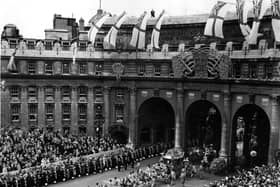 Queen Elizabeth II Coronation carriage and procession coming through Admiralty Arch on the way from Westminster Abbey to Buckingham Palace