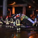 Firefighters work on the site of a bus accident on 3 October in Mestre, near Venice (Photo: MARCO SABADIN/AFP via Getty Images)