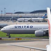 Footage captured of the moment a wheel fell off of a United Airlines Boeing 777 during takeoff, crushing cars below. Picture: Getty Images