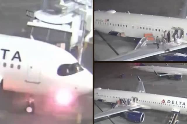 Plane's nose catches fire and passengers evacuate on slide.