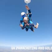 A 102-year-old lady skydiving with an instructor