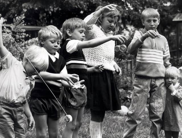 Youngsters showing off their yo-yo skills in the late 80s