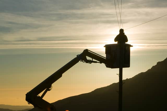 A BT worker fixs telephone lines (Photo: Ashley Cooper/Construction Photography/Avalon/Getty Images)