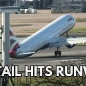 The tail of a plane hitting the ground while trying to land