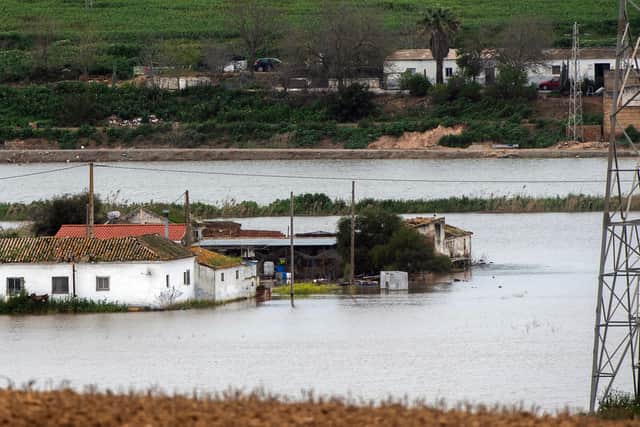 Houses in the middle of a flooded area after Storm Laurence passed through El Palmar de Troya in southern Spain, before Martinho swept in.