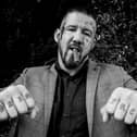 Bare knuckle fighter poses for photograph
