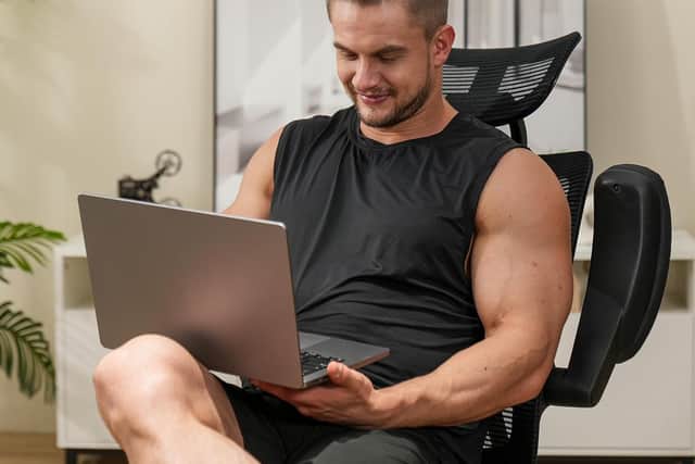 Heavy-duty ergonomic chair with 227kg capacity and flip-up armrests