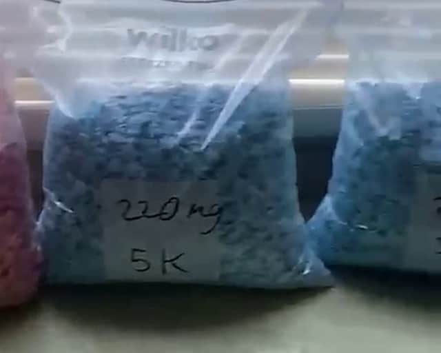 Videos taken from Jamie Stacey-Evans' device show sophisticated machines used to grind crystallised MDMA into powder and count out tens of thousands of ecstasy pills.