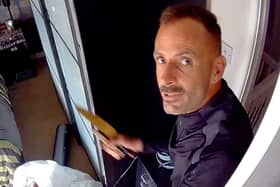 This was the moment arsonist, Martin Foley, spat in the face of a police officer as he was being rescued from a burning roof. 