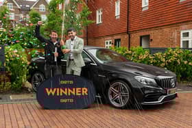 Ali Mohammed (right) popped a bottle of Champagne to toast his huge win