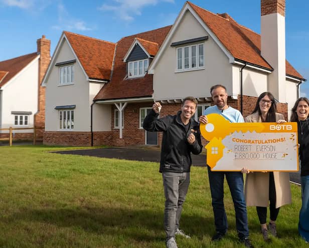 BOTB presenters Christian Williams (right) and Katie Knight (left) with the Robert Everson and his wife Carleane in front of their new dream home