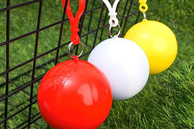 The RainBuddy Compact Portable Poncho packs into a tiny ball case that clips to your bag – perfect for sudden showers during shore excursions.