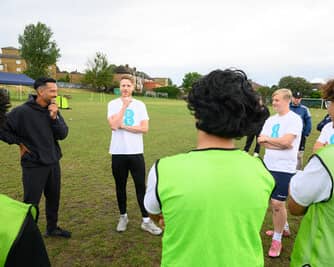 Theo Walcott and Josh Paul offer guidance to young players at Teviot Rangers JFC