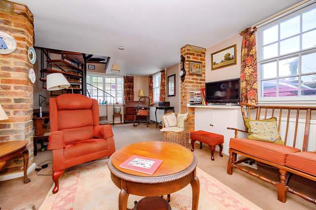 The spacious living room provides a warm and inviting central reception space within the four-bedroom home