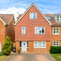 The Adeyfield Road home offers three floors of accommodation alongside driveway parking for up to four cars