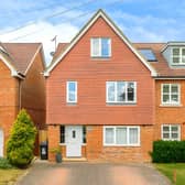 The Adeyfield Road home offers three floors of accommodation alongside driveway parking for up to four cars