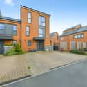 The School End Crescent home combines three floors of contemporary accommodation with driveway parking and an end-of-terrace position