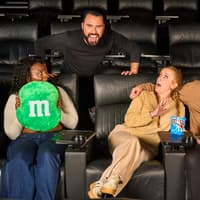 Rylan has disguised himself as a sofa to surprise unsuspecting filmgoers