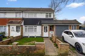 The end-of-terrace house on Frome Square has a driveway and a substantial side garage