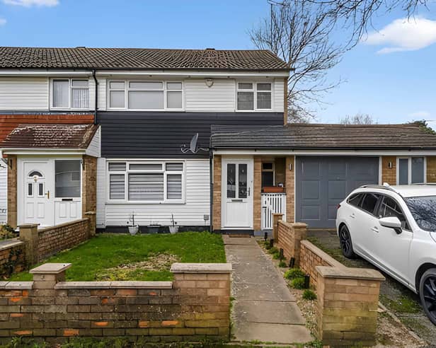 The end-of-terrace house on Frome Square has a driveway and a substantial side garage