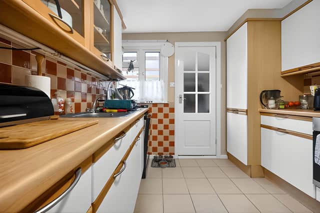 The kitchen forms part of a ground-floor layout that also includes a separate study