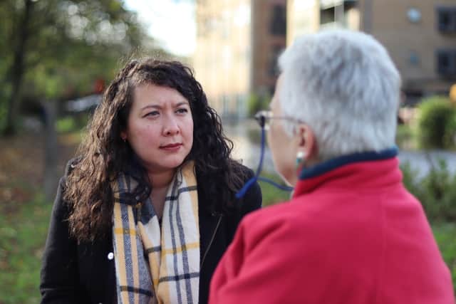 Victoria Collins MP speaking to local residents