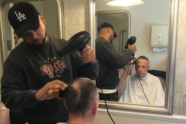 Residents at enjoying a dementia-friendly barbering session through Gold Care Homes' partnership with Dementia Friendly Barbers.