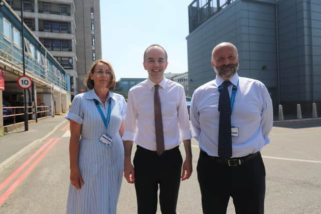 James Murray with West Herts' chair Catherine Dugmore and acting chief executive Paul Bannister