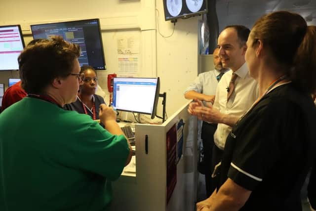 Secretary of State James Murray speaking with A&E staff at Watford General