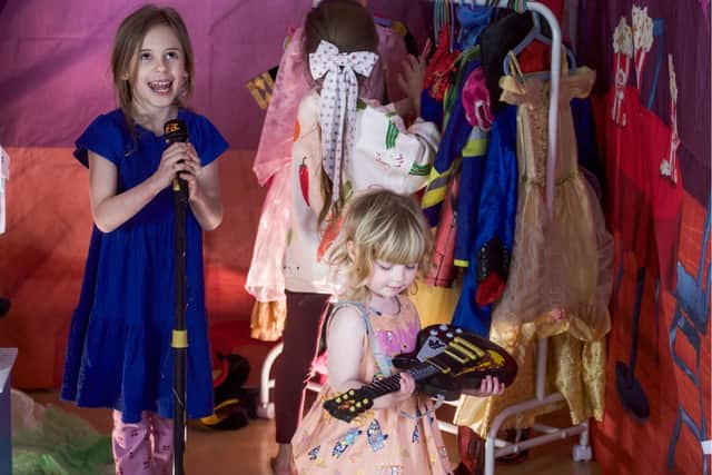 Children enjoy exploring the theatre at Wonder Village, where imaginative play takes centre stage as they dress up, perform and create their own stories.