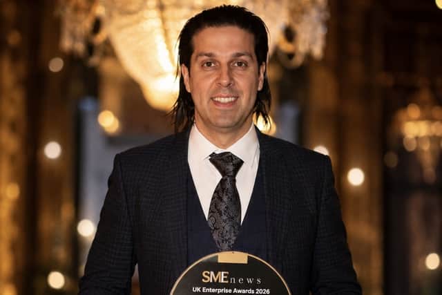 Alex Williams, Managing Director of Tiger Cleaning, holding the company's SME News UK Enterprise Awards 2026 after being recognised for excellence in cleaning and customer satisfaction.
