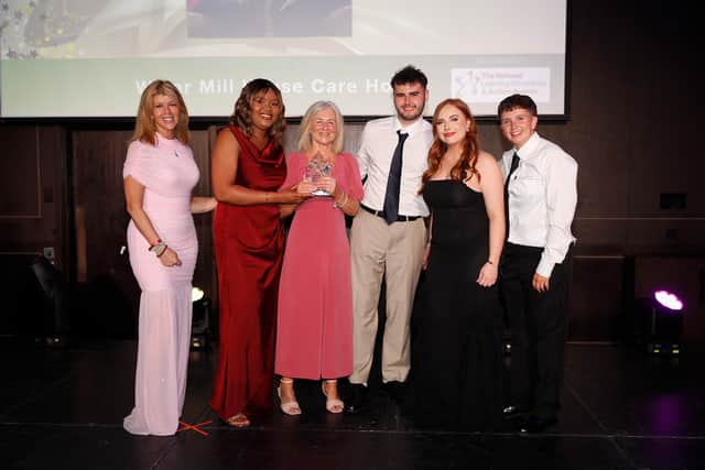 Kate Garraway, presents the award to team members from the Water Mill House Care Home
