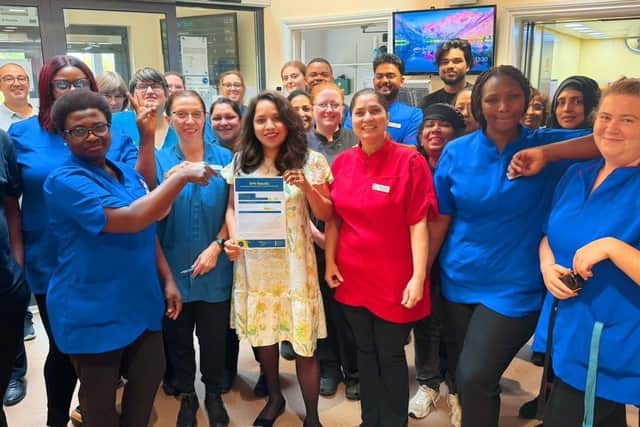 Staff at Fremantle Court celebrating Home Manager Deepthi's results
