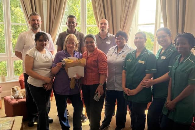 Margaret receiving her 15 year Long Service Award from Mary Jane Bague, General Manager at Bushey House Beaumont
