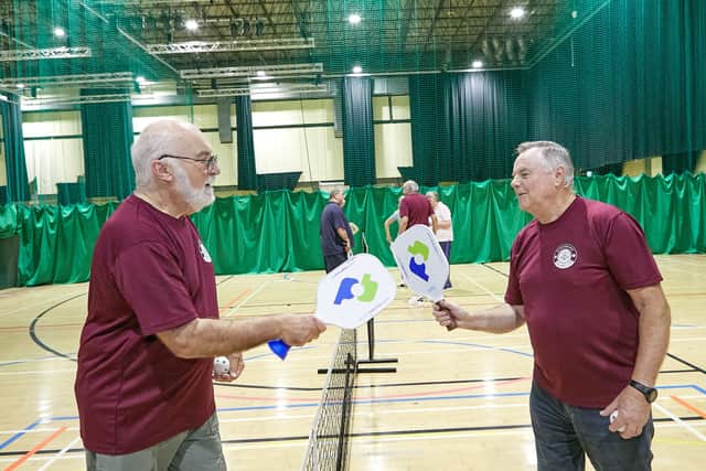 Pickleball combines elements of tennis, badminton and table tennis on a compact court.