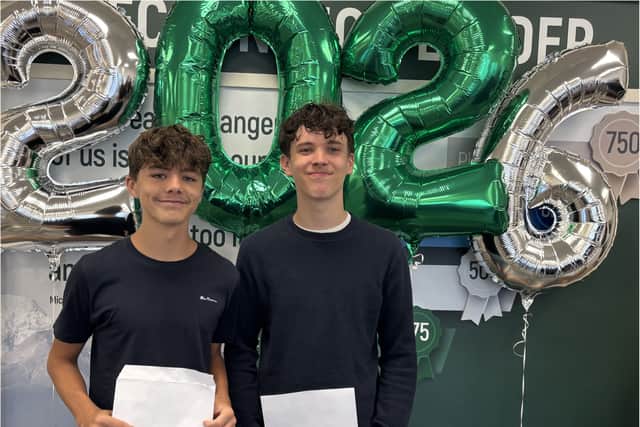 Students proudly receive their GCSE results.