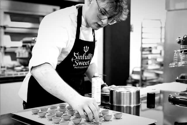 Pastry chef James Robinson preparing some of his signature chocolates