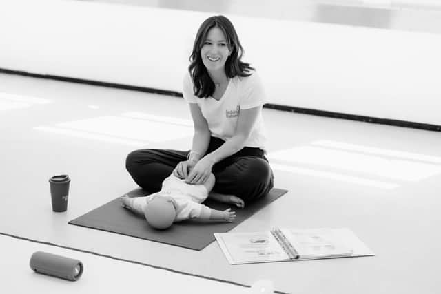 Laura teaching a Basking Babies class