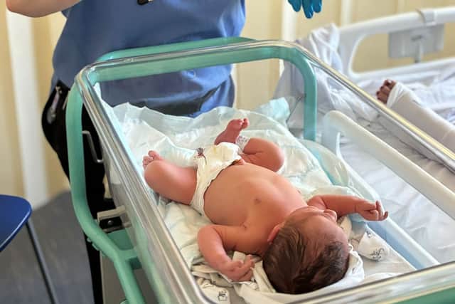 Faith with newborn baby Luca