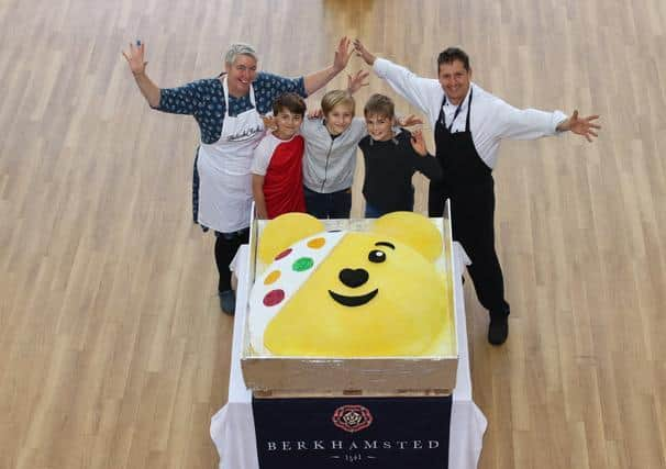 Belinda Clark and Phil Clark, group executive chief for Berkhamsted Schools, with Josh pictured in the middle with two of his friends