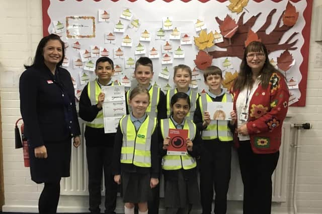 Students being given their high-visibility vests