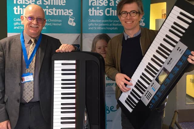 Choirmaster Gareth Malone, right, and David Head, charity director at Raise