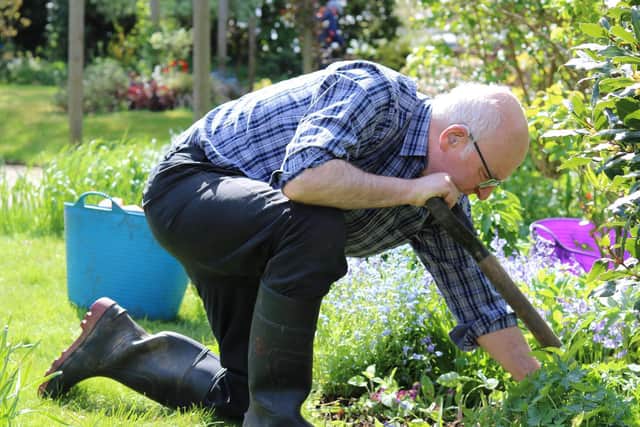 Volunteer works at Grove House Garden