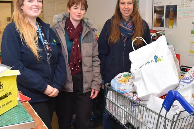 Chloe and Natalie from Hightown and Michelle from DENS Foodbank